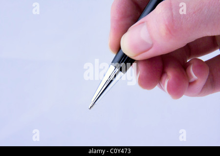 Hand und Stift Stockfoto