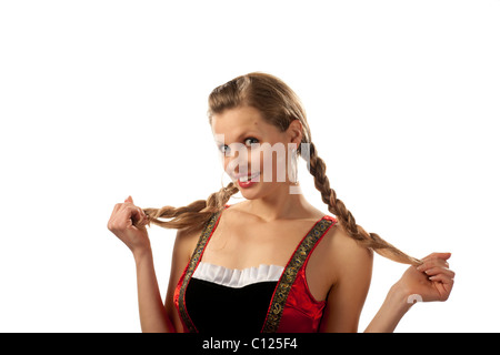 Junge Frau, 24 Jahre alt, mit Zöpfen, in eine kurze Dirndl, frechen Stockfoto