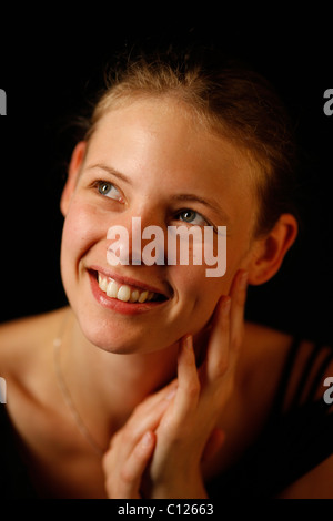 Junge Frau setzen Sie ihre Hände, Ihr Gesicht, Porträt Stockfoto