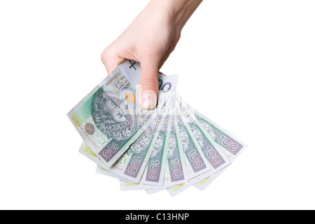 Hand mit polnischen Geld isoliert auf weiss Stockfoto