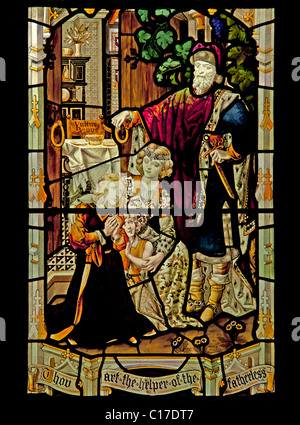 Taten der Nächstenliebe Fenster, (Detail). Kirche von Saint-Martin, Bowness-on-Windermere, Lake District National Park, Cumbria, England. Stockfoto
