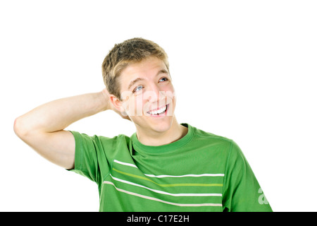 Entspannt lächelnd jungen Mann mit der Hand hinter dem Kopf, isoliert auf weiss Stockfoto