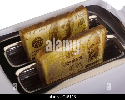 Toast der US-Währung herausspringen aus einem toaster Stockfoto