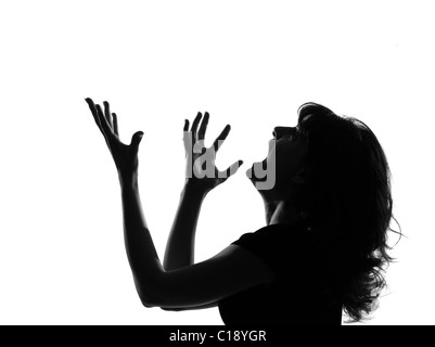 Porträt-Silhouette im Schatten einer jungen Frau Kreischen Ärger im Studio auf weißen Hintergrund isoliert Stockfoto