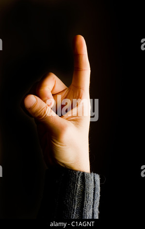 männliche Hand zeigt Finger-Geste Stockfoto
