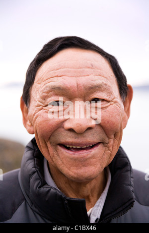 Lächelnd Mann, Narsaq, Süd-Grönland. Stockfoto