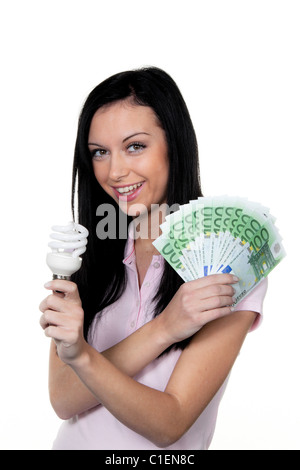 Frauen mit Energiesparlampe. Energiesparende Lampe und Euro-Währung Stockfoto