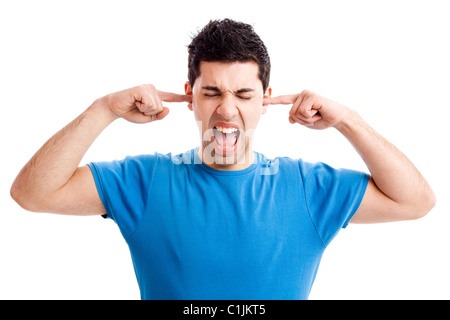 Portrait of disturbed young woman shouting while putting fingers on the hears Stockfoto