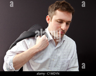 Geschäftsmann am Ende eines langen Tages Stockfoto