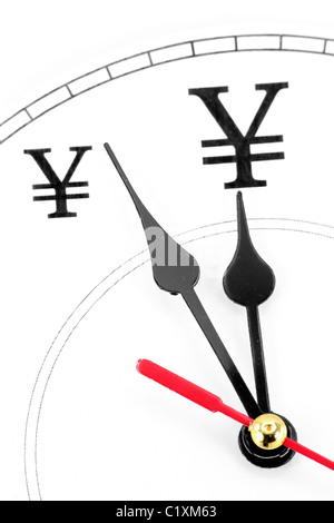 Uhr und Yen-Zeichen, Begriff der Zeit ist Geld Stockfoto