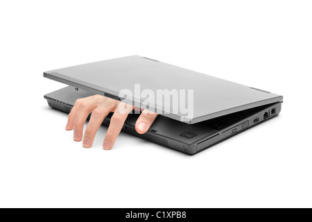 Eine Hand greift aus einem laptop Stockfoto