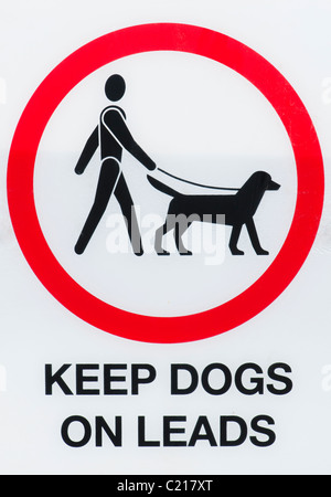Halten Sie Hunde an Leads Zeichen Stockfoto