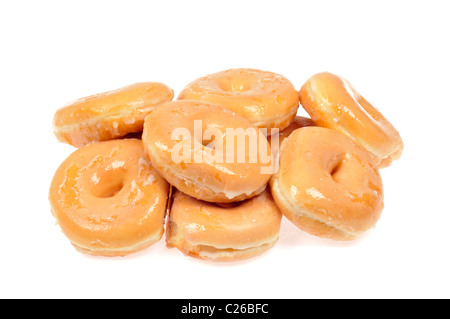 Haufen von glasierte Donuts auf weißem Hintergrund, ausgeschnitten. Stockfoto