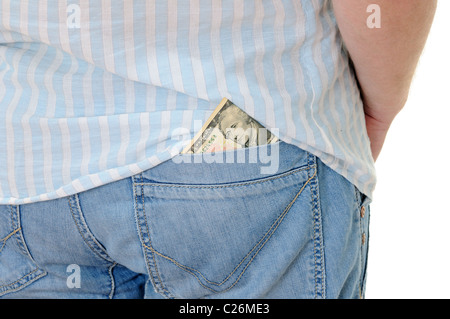 Zehn Dollar kleben aus einer Tasche Blue Jeans Stockfoto