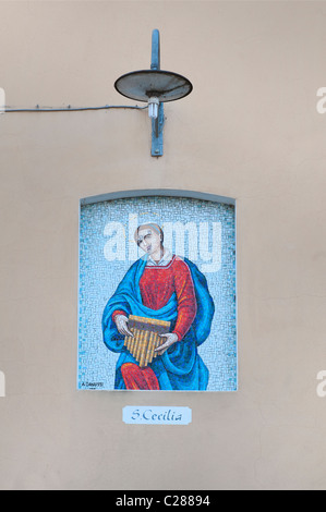 St. Cecilia Mosaik Symbol an einer Wand Stockfoto