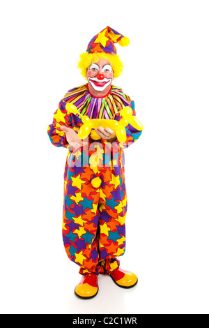 Voller Körper isoliert Blick auf ein Geburtstag Clown hält eine Ballon-Tier. Stockfoto