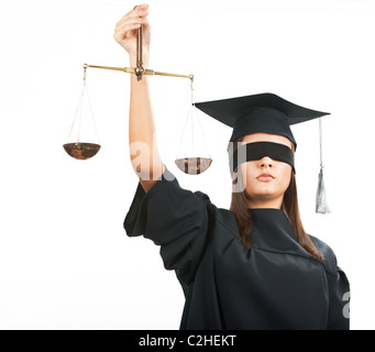 Junger Anwalt mit geschlossenen Augen, die Waage halten Stockfoto