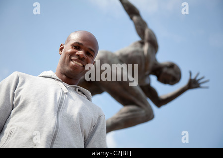 Kim Collins steht die Statue eines Sprinter auf sich selbst modelliert nach seiner Leistung in der Commonwealth Games in Manchester Stockfoto