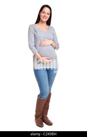 Foto von einer attraktive Brünette Frau, die 32 Wochen schwanger isoliert auf einem weißen Hintergrund. Stockfoto