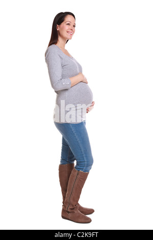 Foto von einer attraktive Brünette Frau, die 32 Wochen schwanger isoliert auf einem weißen Hintergrund. Stockfoto