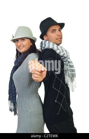 Moderne modische paar stehen Rücken an Rücken und Hand in Hand isoliert auf weißem Hintergrund Stockfoto