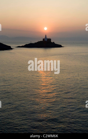 Sonnenaufgang über dem kleinen Dorf Mumbles in der Nähe von Swansea in Süd-Wales, UK. Stockfoto