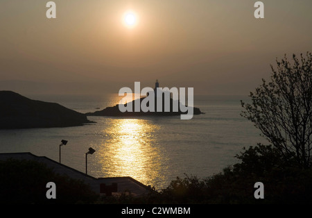 Sonnenaufgang über dem kleinen Dorf Mumbles in der Nähe von Swansea in Süd-Wales, UK. Stockfoto