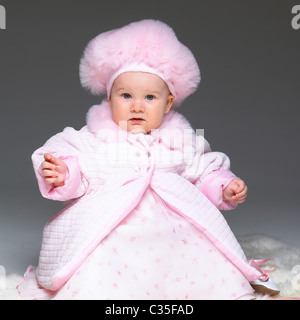 Babymädchen in rosa outfit Stockfoto