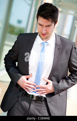 Mann mit Magenschmerzen Stockfoto