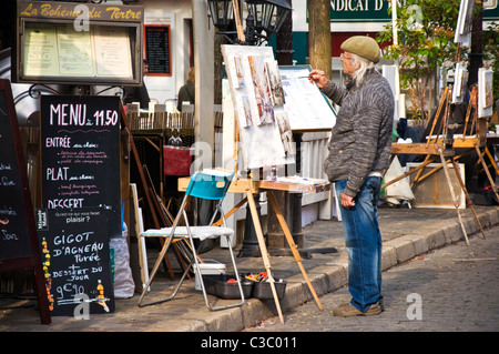 Streetart-Künstler Farben in Place du Tertre Montmartre Paris Restaurants Stockfoto