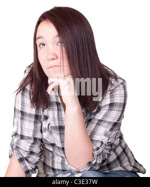 Ein Foto eines Mädchens isoliert sitzt mit ihrer Hand unter ihr Kinn Leben nachzudenken.