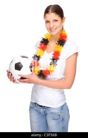 Voll isolierte Studio Bild von einer jungen und schönen Frau mit Fußball und Deutschland Flagge Stockfoto