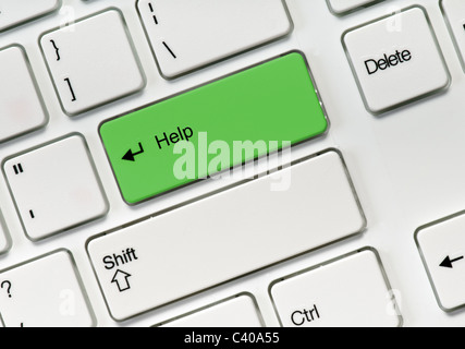 Helfen, grüne Taste auf weiße Tastatur Stockfoto