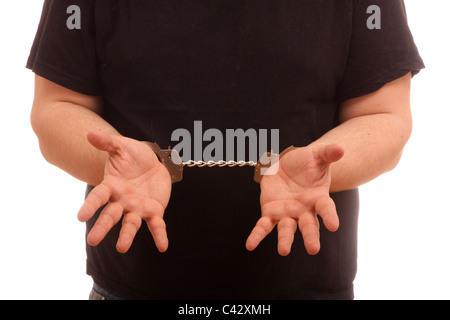 Mann auf Hände mit Handschellen Stockfoto