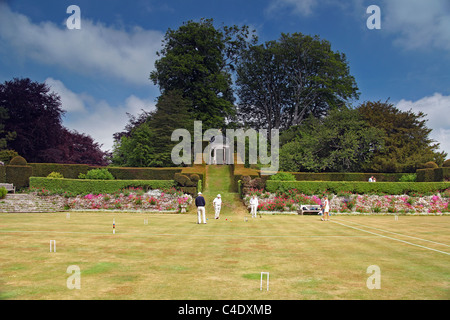 Eine Partie Krocket statt auf dem Croquet Rasen an Kingston Maurward College, Dorchester, Dorset, England, UK Stockfoto