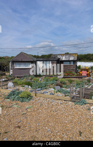 Häuser am Strand von Pevensey Bay East Sussex, England Stockfoto