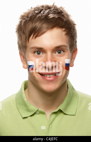 Junge männliche Sportfan mit slowakischen Flagge auf Gesicht gemalt Stockfoto