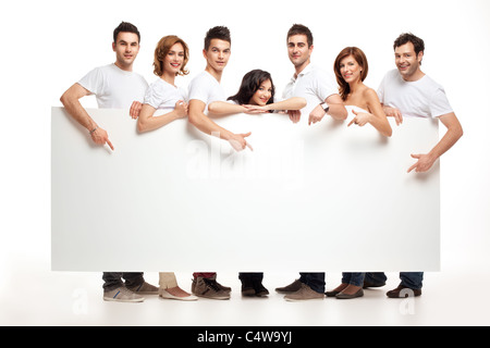 Team von lächelnden Menschen halten Banner zeigen Stockfoto