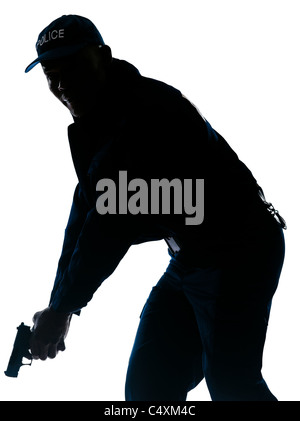 Silhouette Bild Afro amerikanische Polizisten halten Pistole im Studio auf weißen Hintergrund isoliert Stockfoto