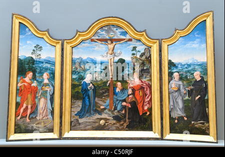 Die Kreuzigung mit Heiligen und Spender, ca. 1520 von Joos van Cleve und ein Mitarbeiter Stockfoto