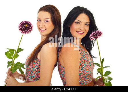 Schöne Frauen dasselbe Kleid trägt und hält Blumen isoliert auf weißem Hintergrund Stockfoto