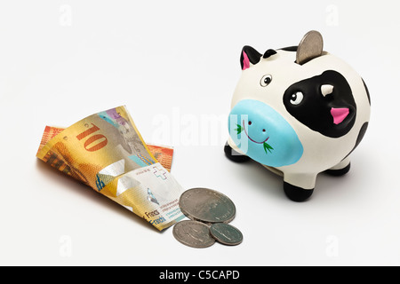 Sparschwein mit Schweizer Geld Stockfoto