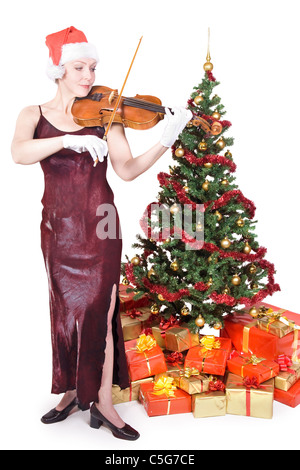 Frau spielt Bratsche in die Weihnachtsmütze Stockfoto