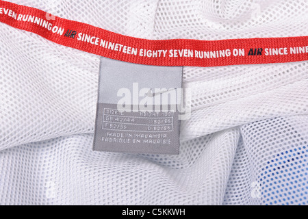 Nylon Nike Air windrunner Sportswear Herren regen Jacke Full Zip mit Kapuze. Waschen Pflegeetikett detail Stockfoto