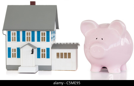 Haus und Sparschwein Stockfoto