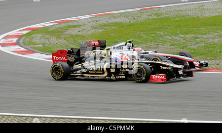 Witali Petrow (RUS), Renault und Jenson Button (GBR), McLaren-Mercedes, während die deutschen Formel 1 Grand Prix 2011 Stockfoto