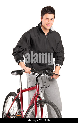 Ein kleiner Junge posiert auf dem Fahrrad Stockfoto