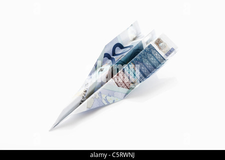 Papier Flugzeug aus 20 Euro Geldschein gefaltet Stockfoto