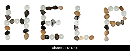 Helfen Sie Wort, das aus Sand Steine Stockfoto