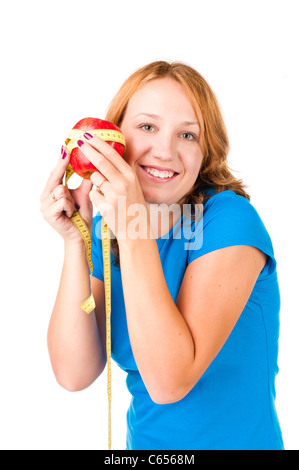 Porträt einer jungen Sport Frau hält Apfel und Maßband auf weißem Hintergrund Stockfoto